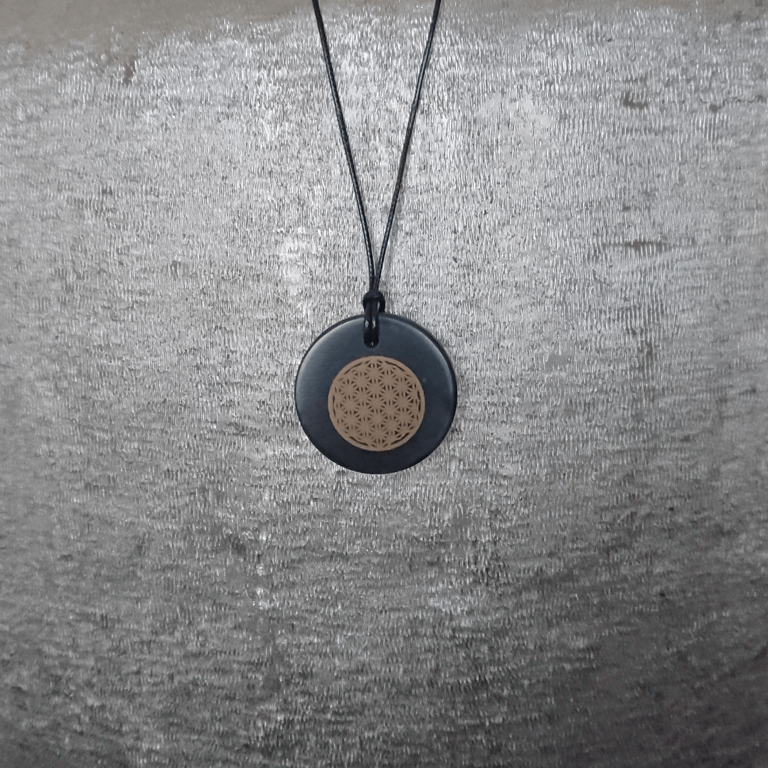 Discover the Power of Shungite with Our Flower of Life Pendant